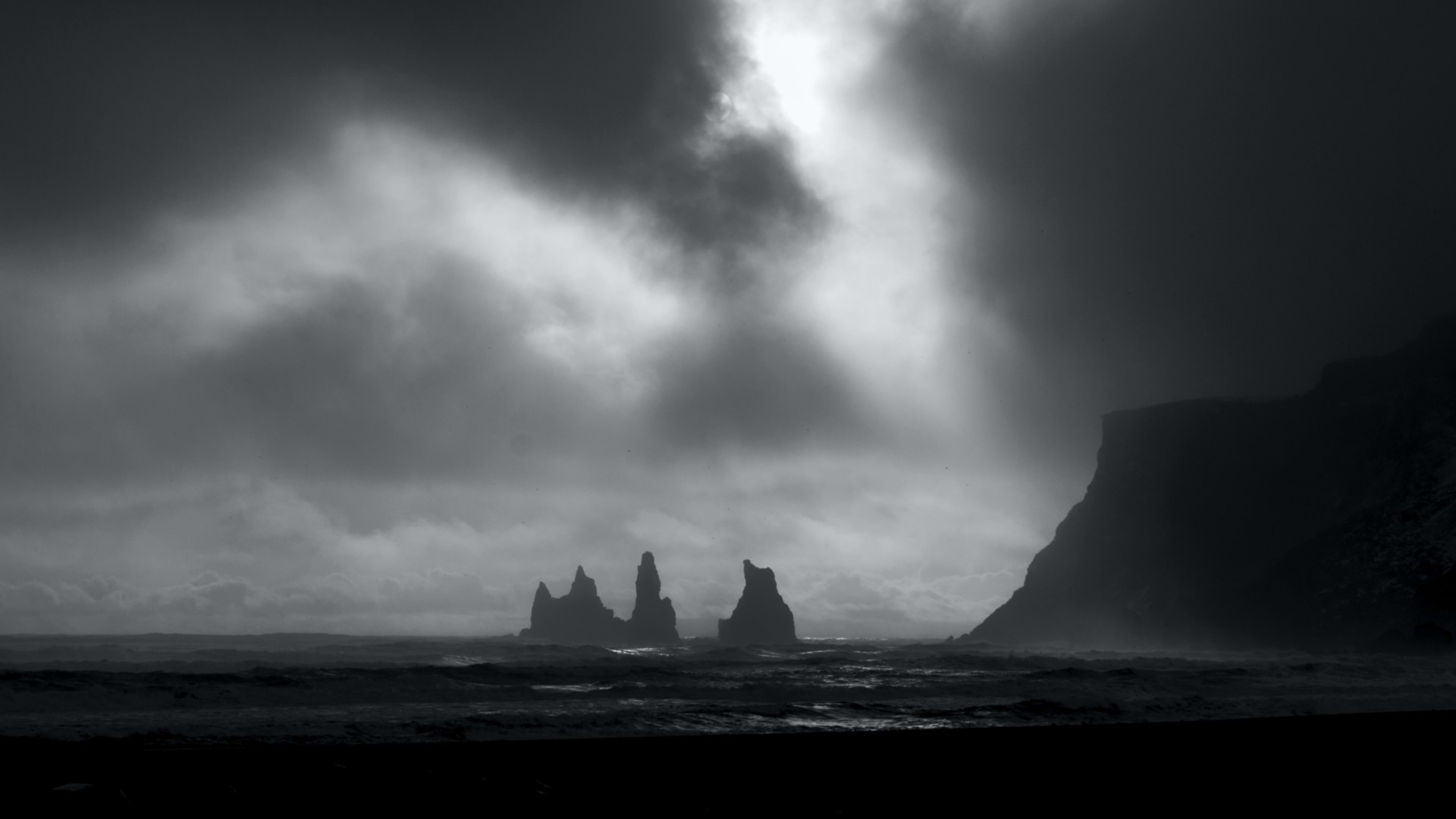 Reynisdrangar sea stacks seen from the beach at Vík