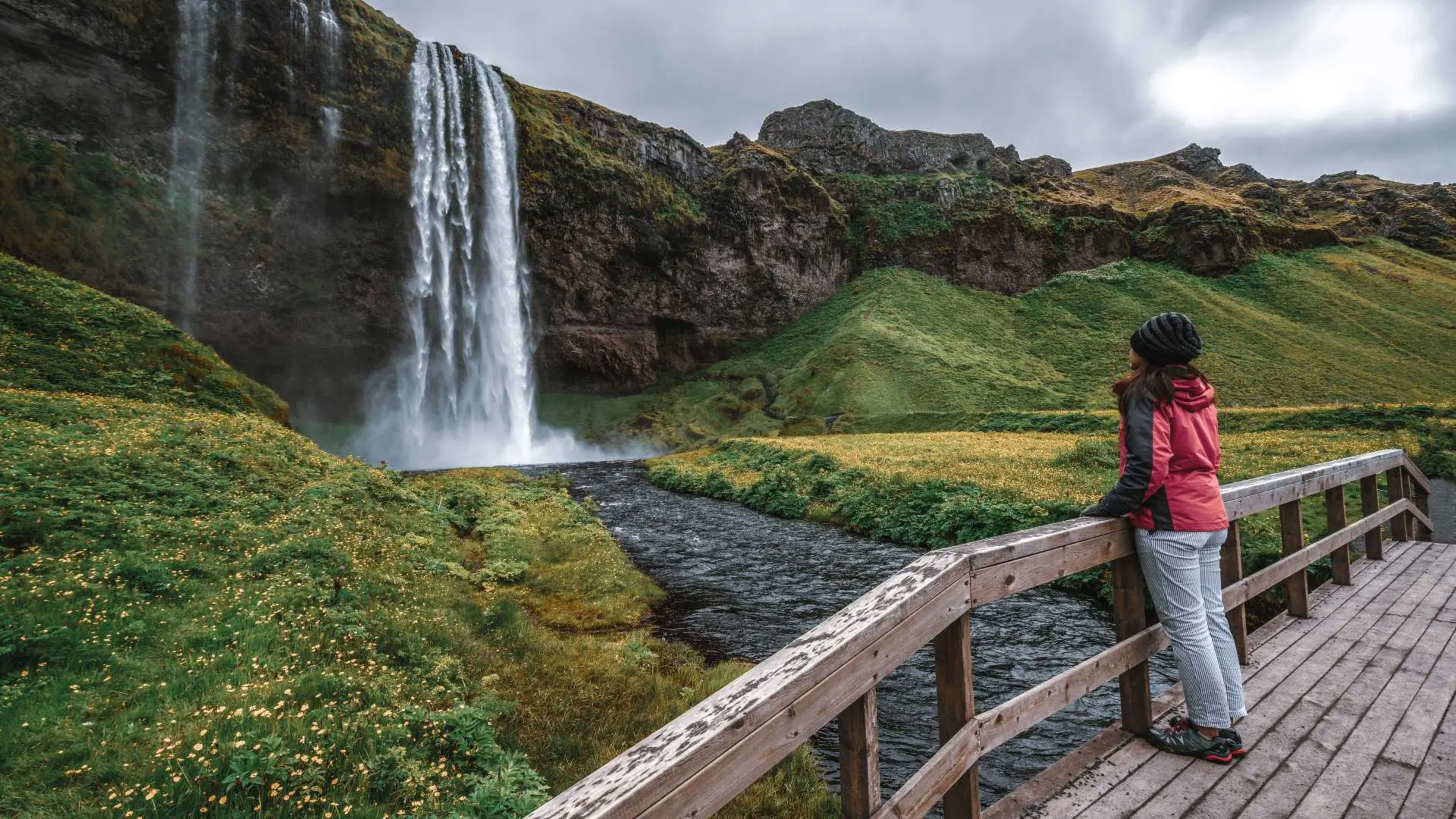 woman-standing-at-seljalandsfoss-getty-images-unsplash.jpg.webp