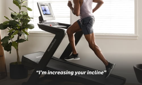 man running on the 1750 treadmill while the ifit trainer controls the workout