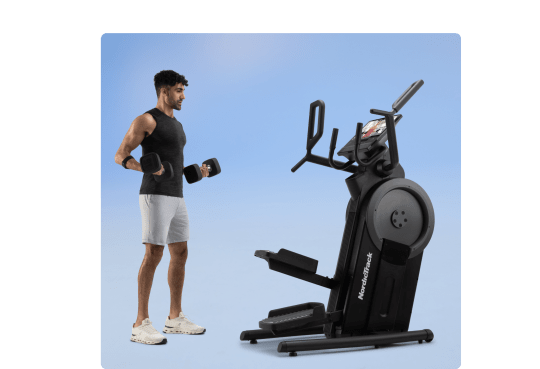 man exercising along side the x16i elliptical