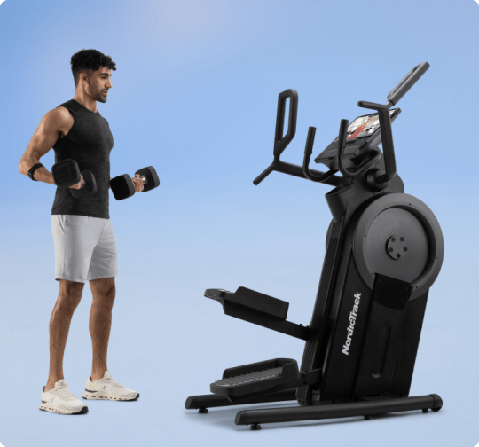 man exercising along side the elliptical