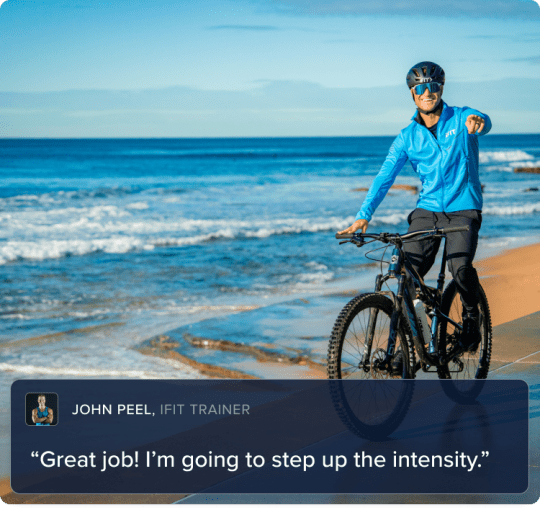 trainer riding his bike on a trail near the beach