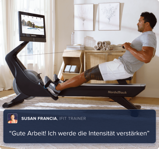 man rowing on his rower with an iFIT trainer.