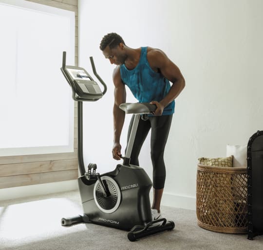 woman adjusting the seat of the VU 29 exercise bike