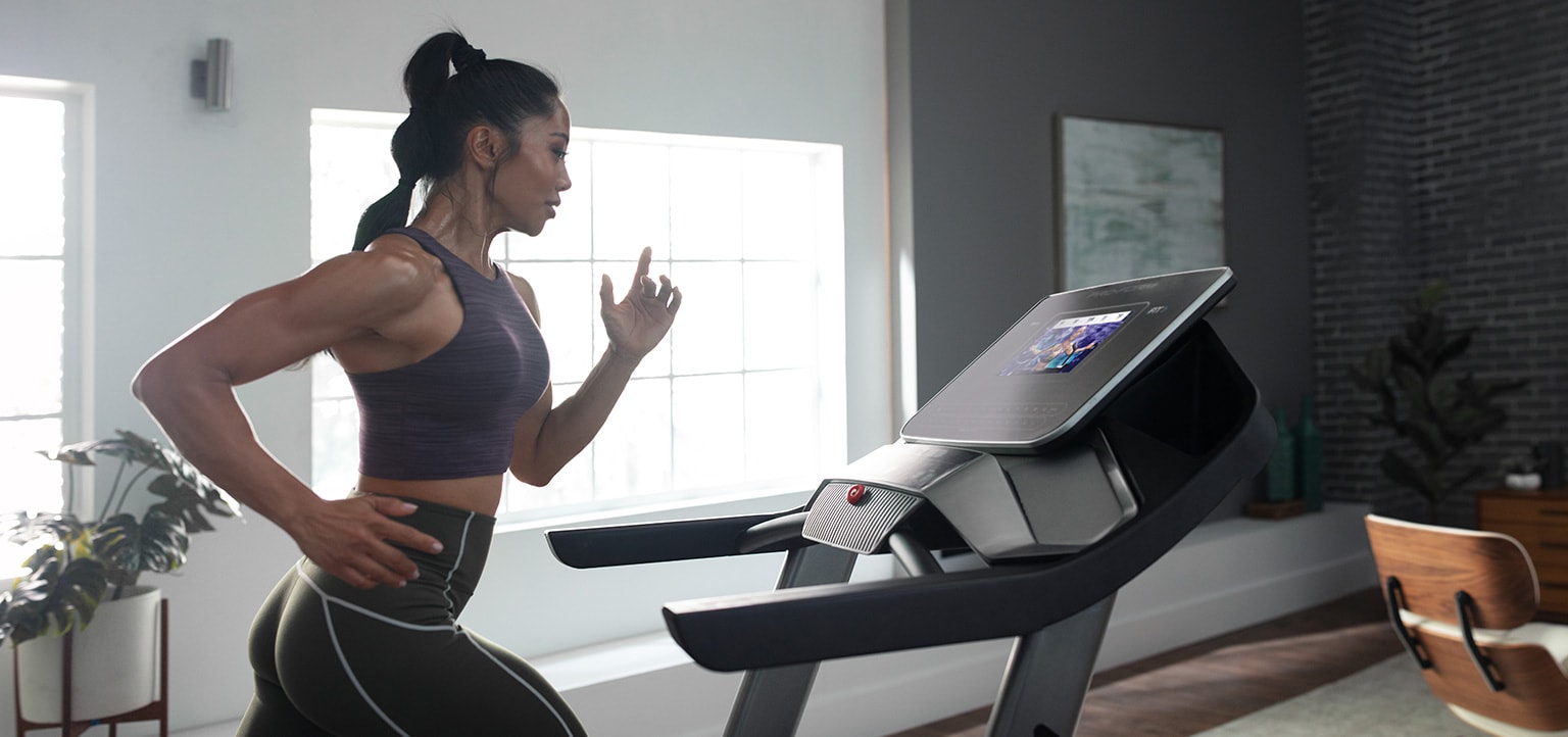 Woman running on the Pro 2000 treadmill.