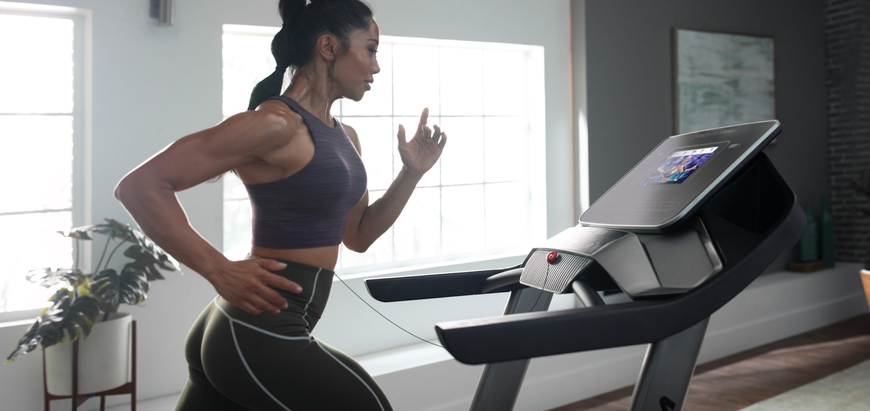 Woman running on the Pro 2000 treadmill.