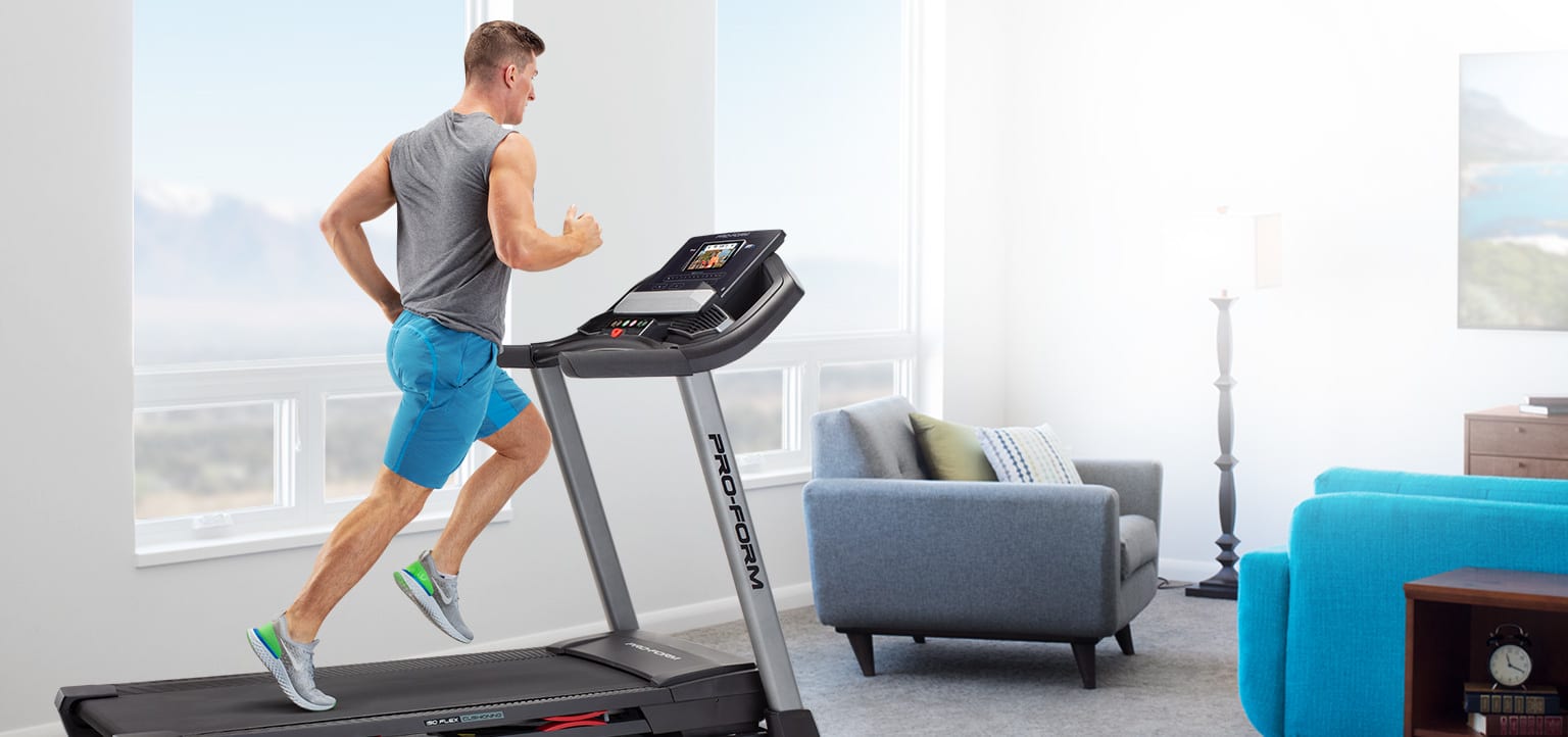 Man running on the Carbon T7 treadmill.