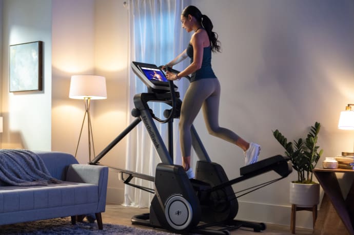 Woman working out on the FS14i Free Stride Elliptical