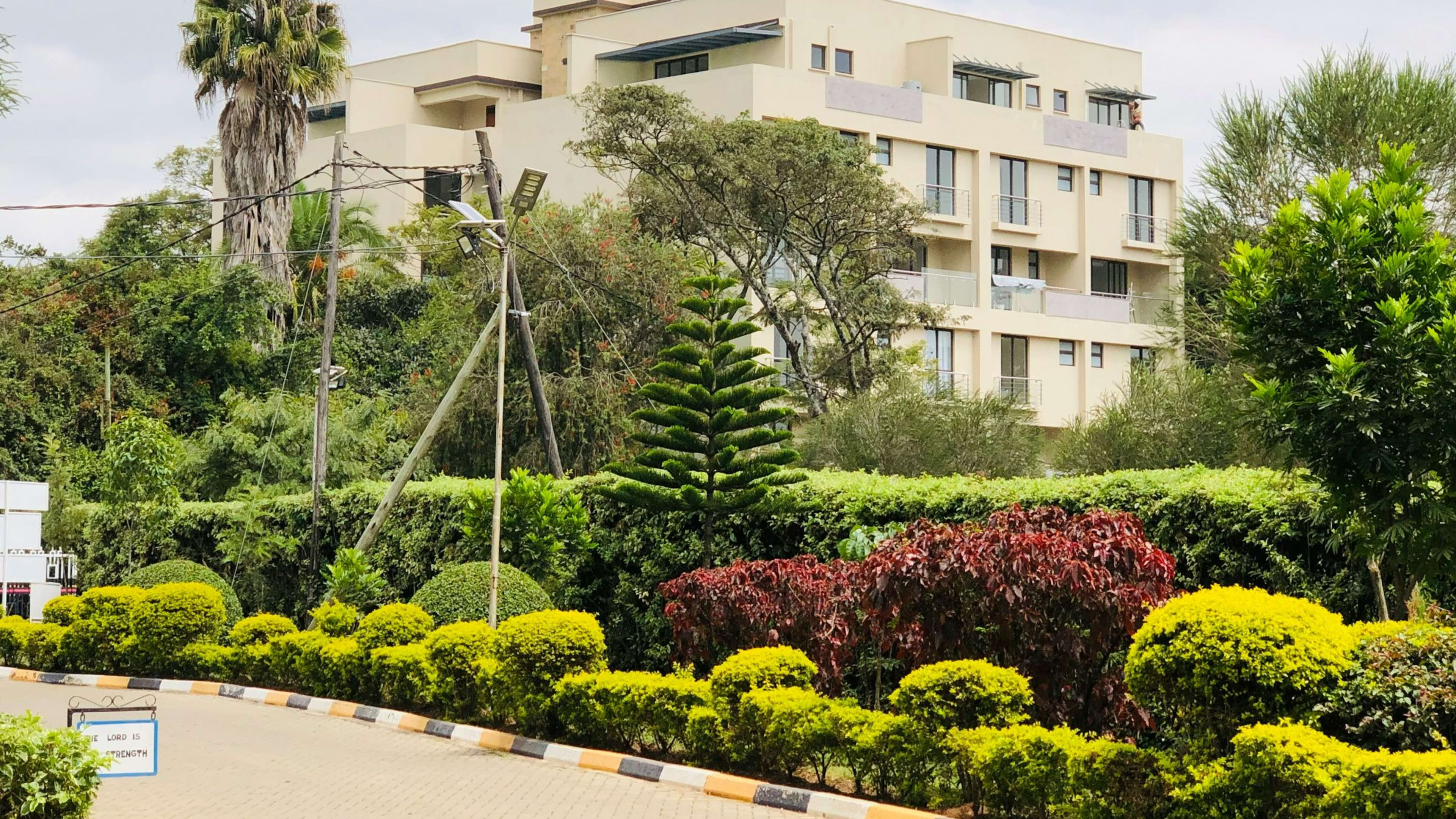 Low-rise apartment blocks around a landscaped garden