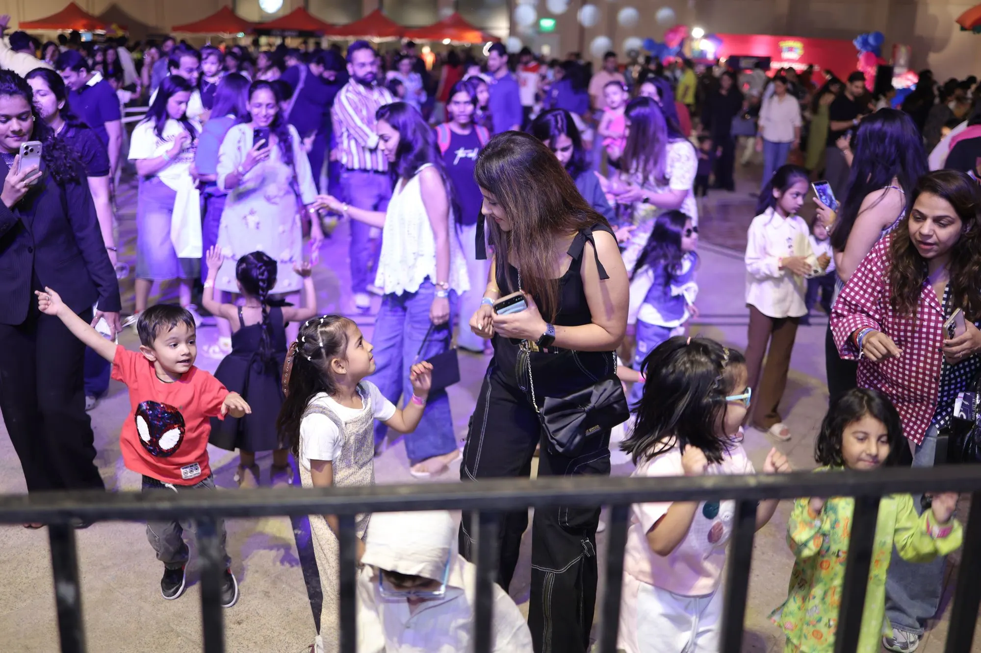 Parents and children on the Toddler Techno Party dance floor