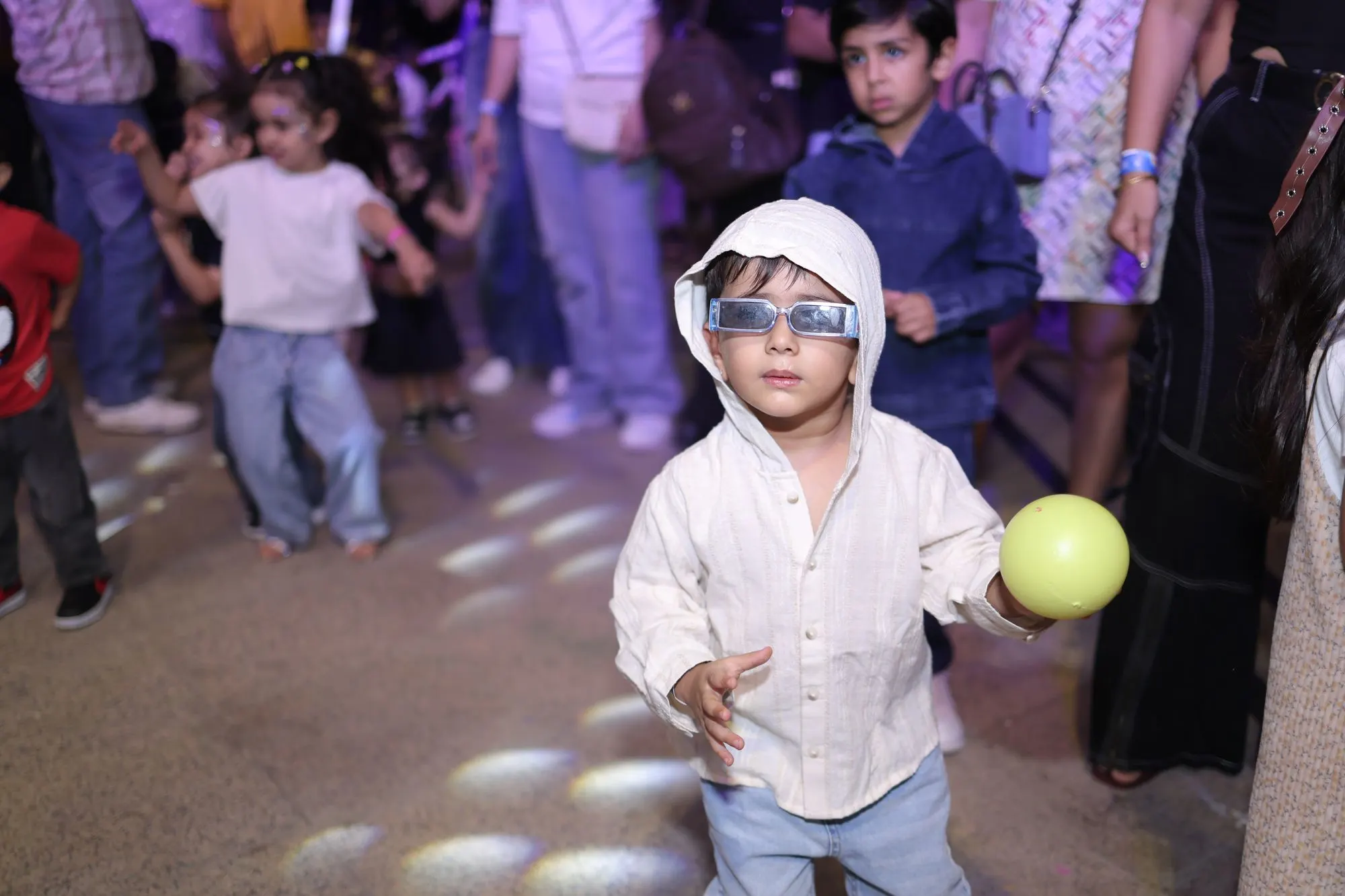 Child with a balloon on the dance floor