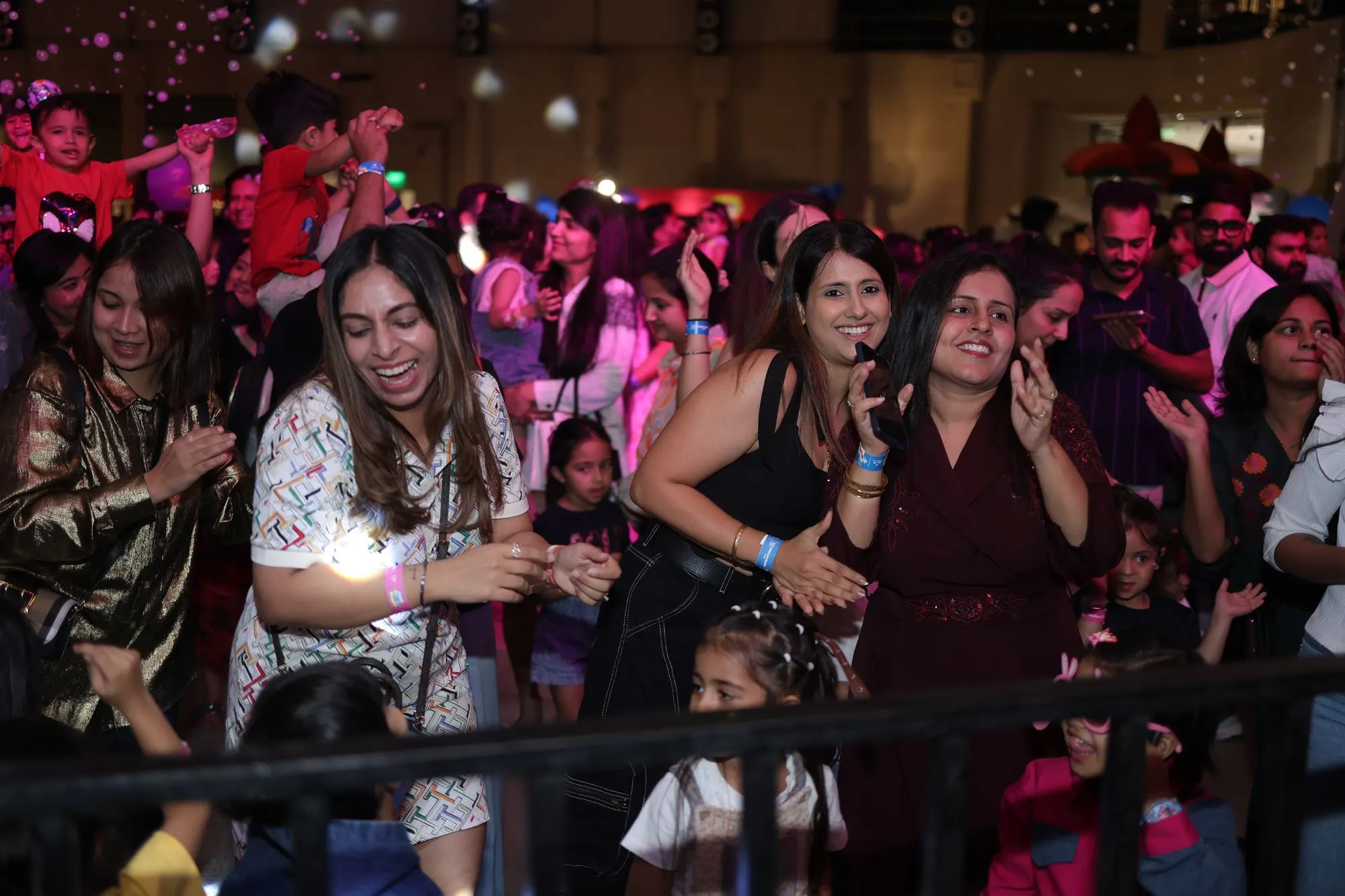 Parents dancing at the front of the crowd