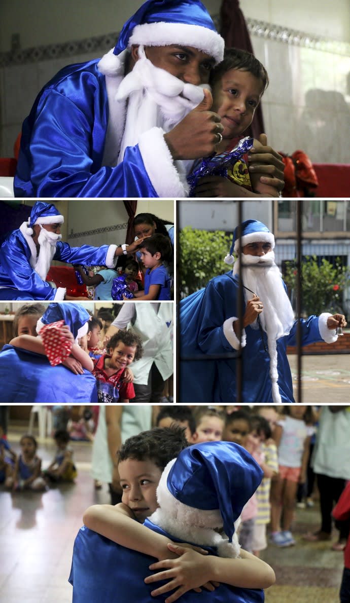 Pedro Rocha se veste de Papai Noel azul e surpreende crianças em creche