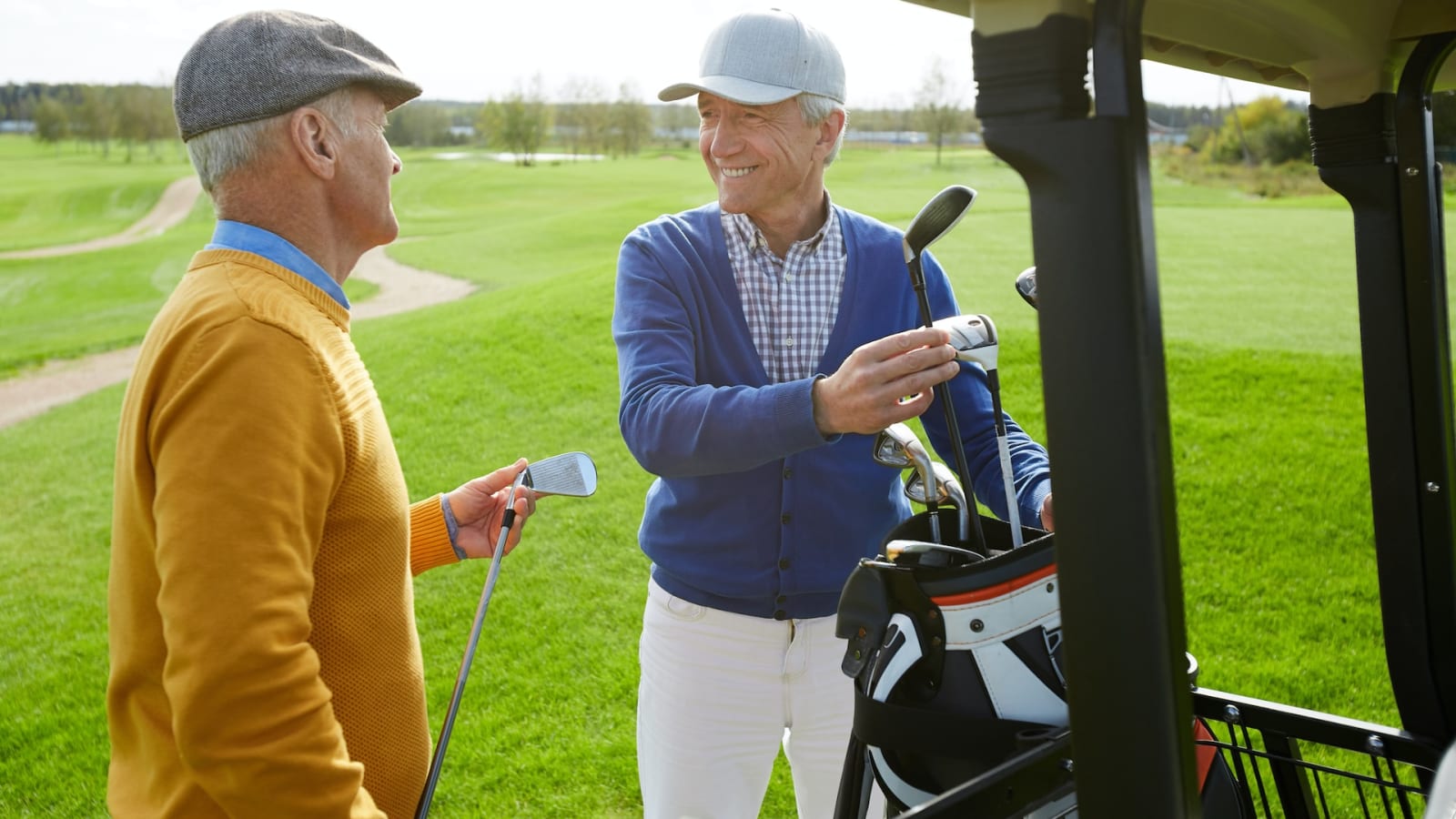two seniors on a golf course