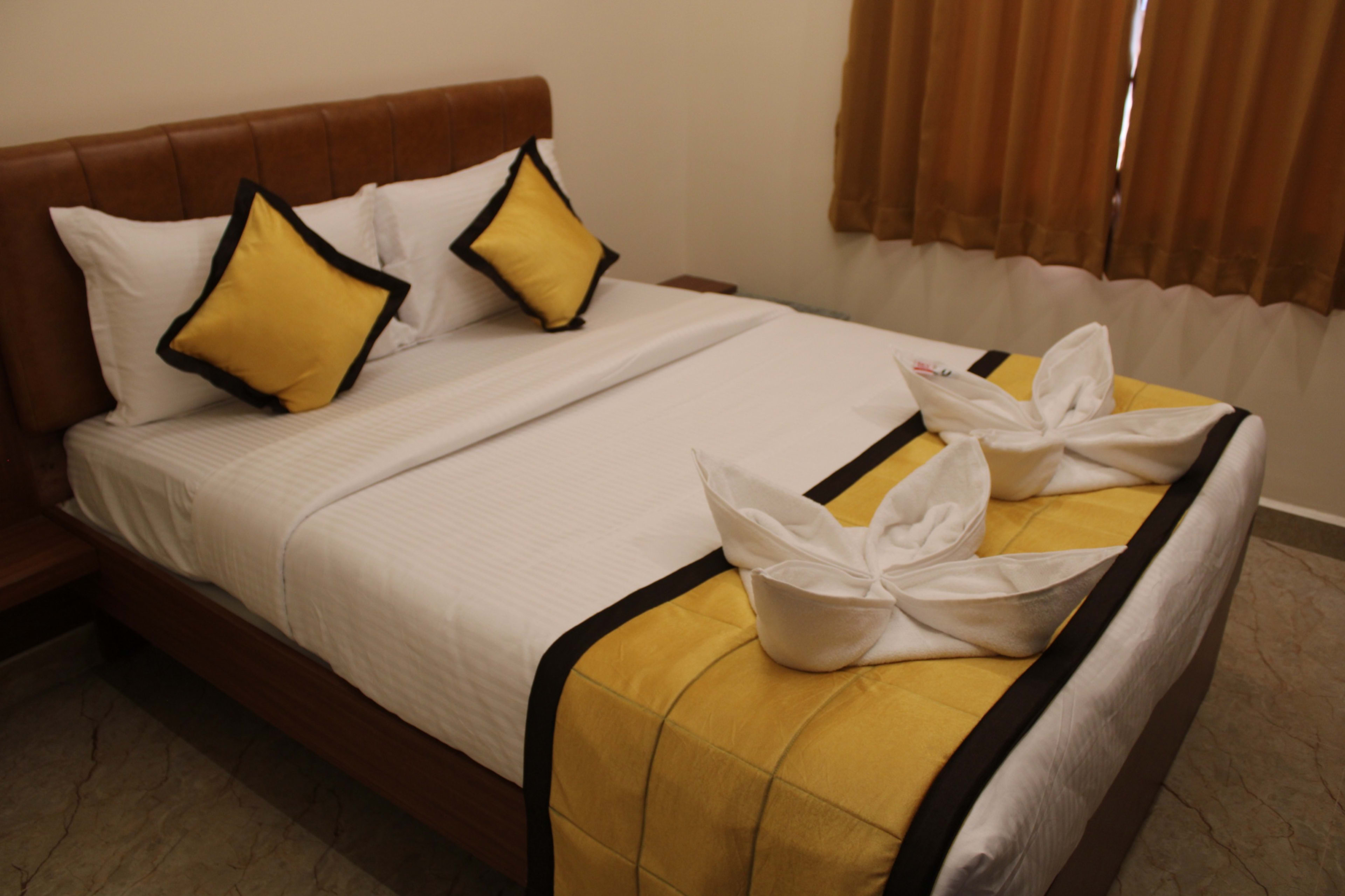 Business Comfort Room interior with modern amenities — UJ Pallazzio, Tiruvannamalai