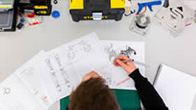 woman working with engineering and technical documents