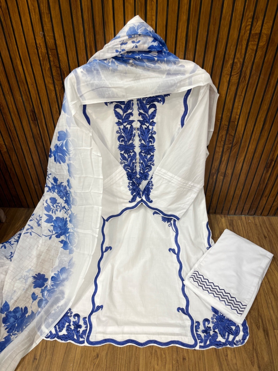 This stunning white blue suit features elegant black heavy embroidery