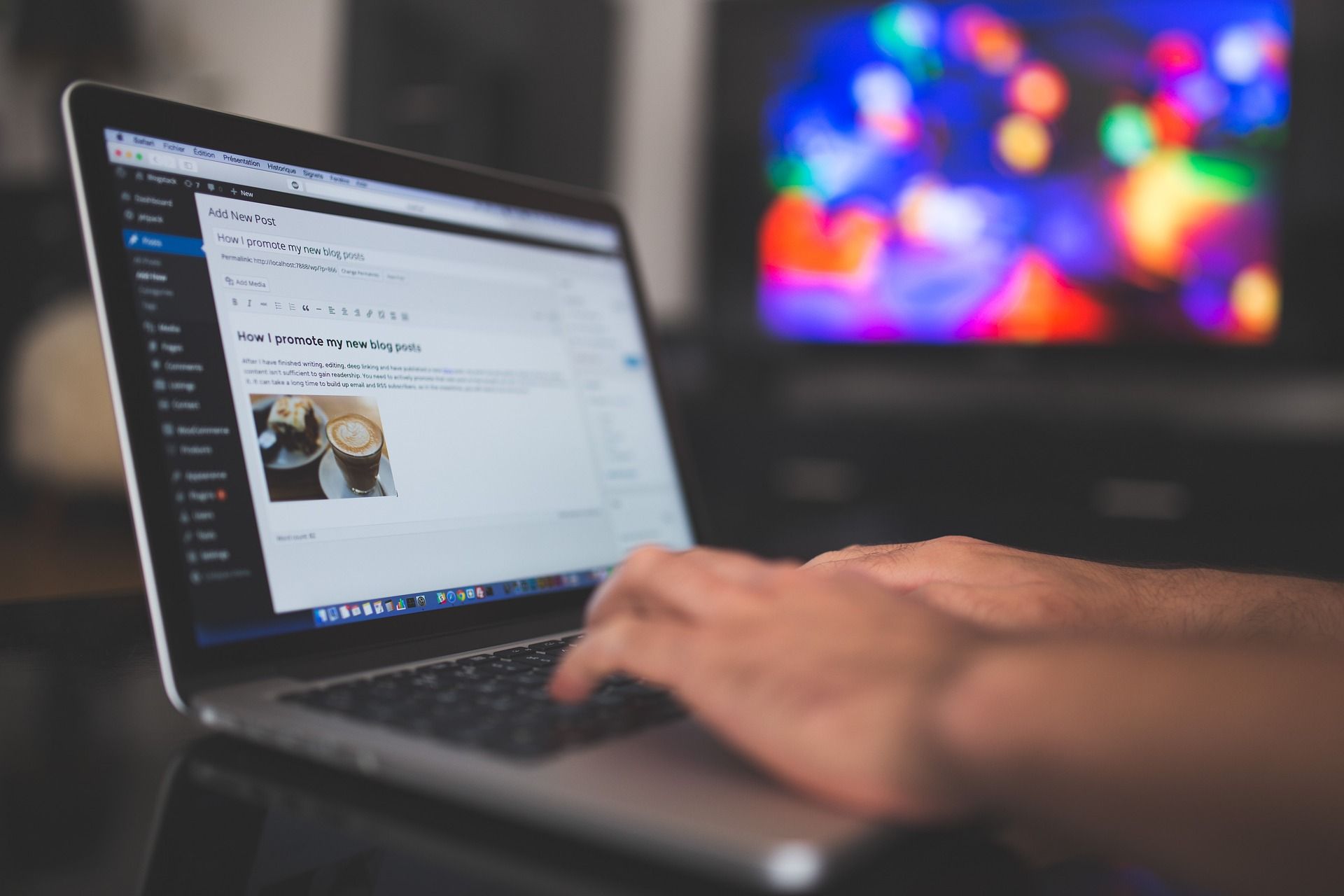 A close-up of someone writing a blog post on the WordPress backend on their laptop