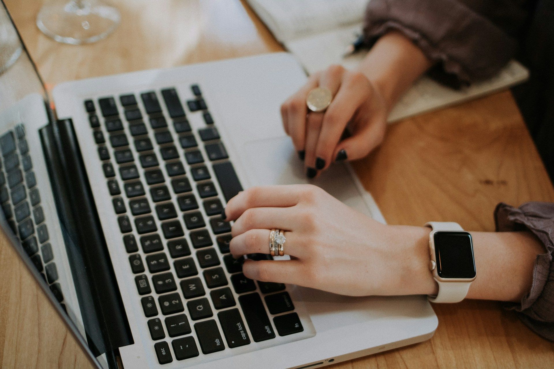 A female business owner working on her laptop to optimize her website