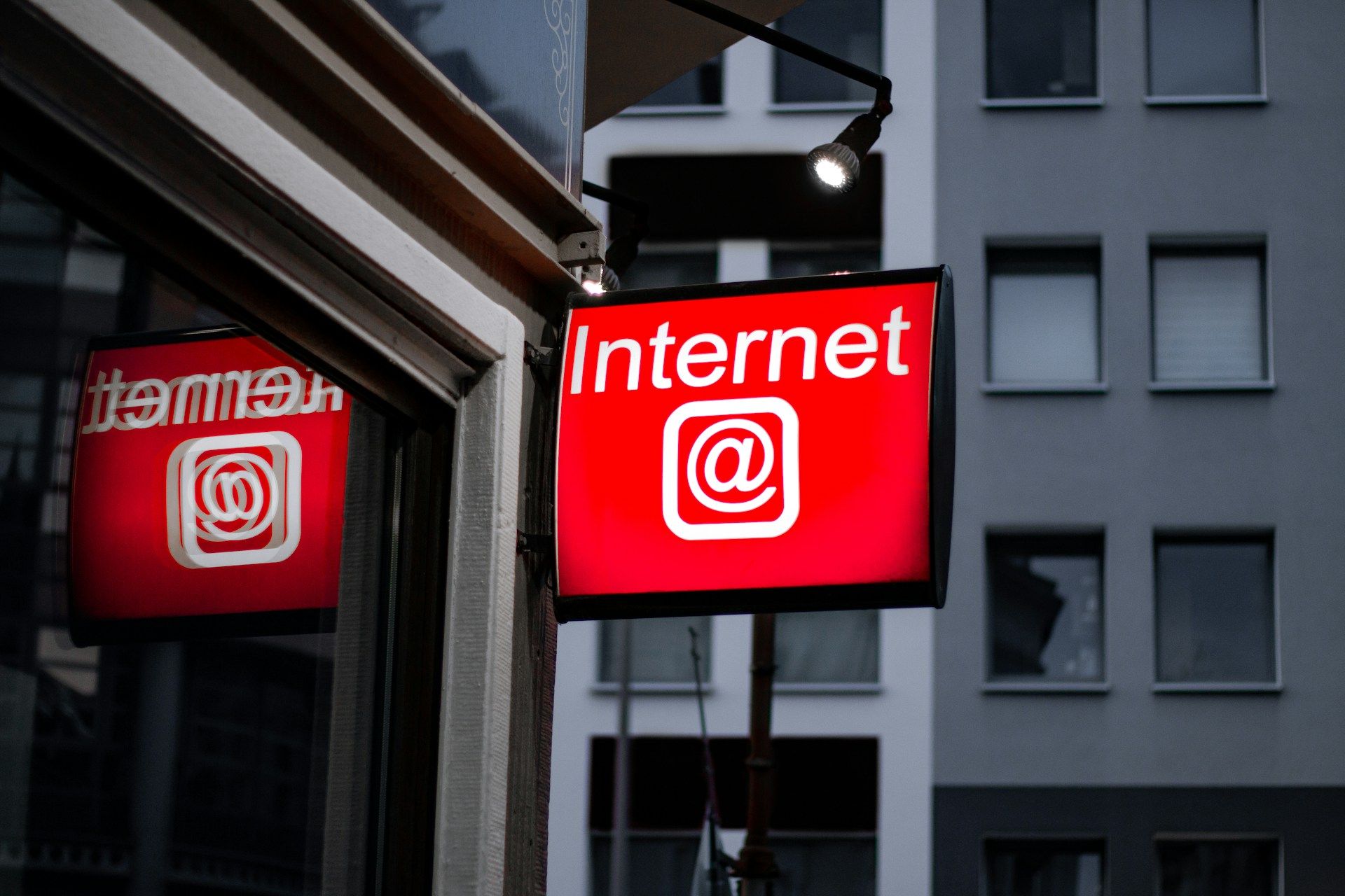  A red street sign that reads “Internet @”