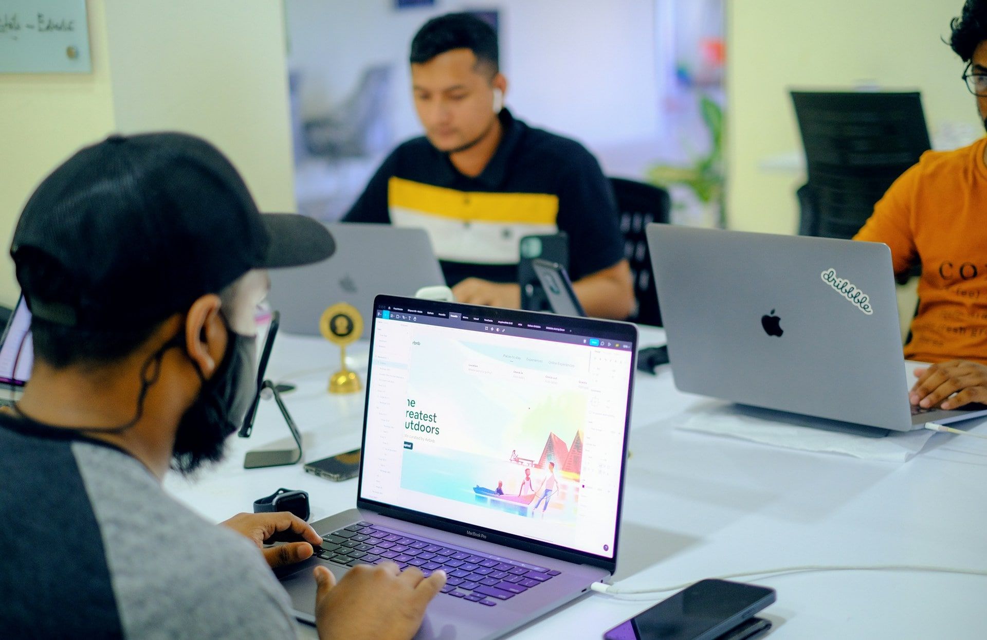 A group of web developers working on speeding up a website