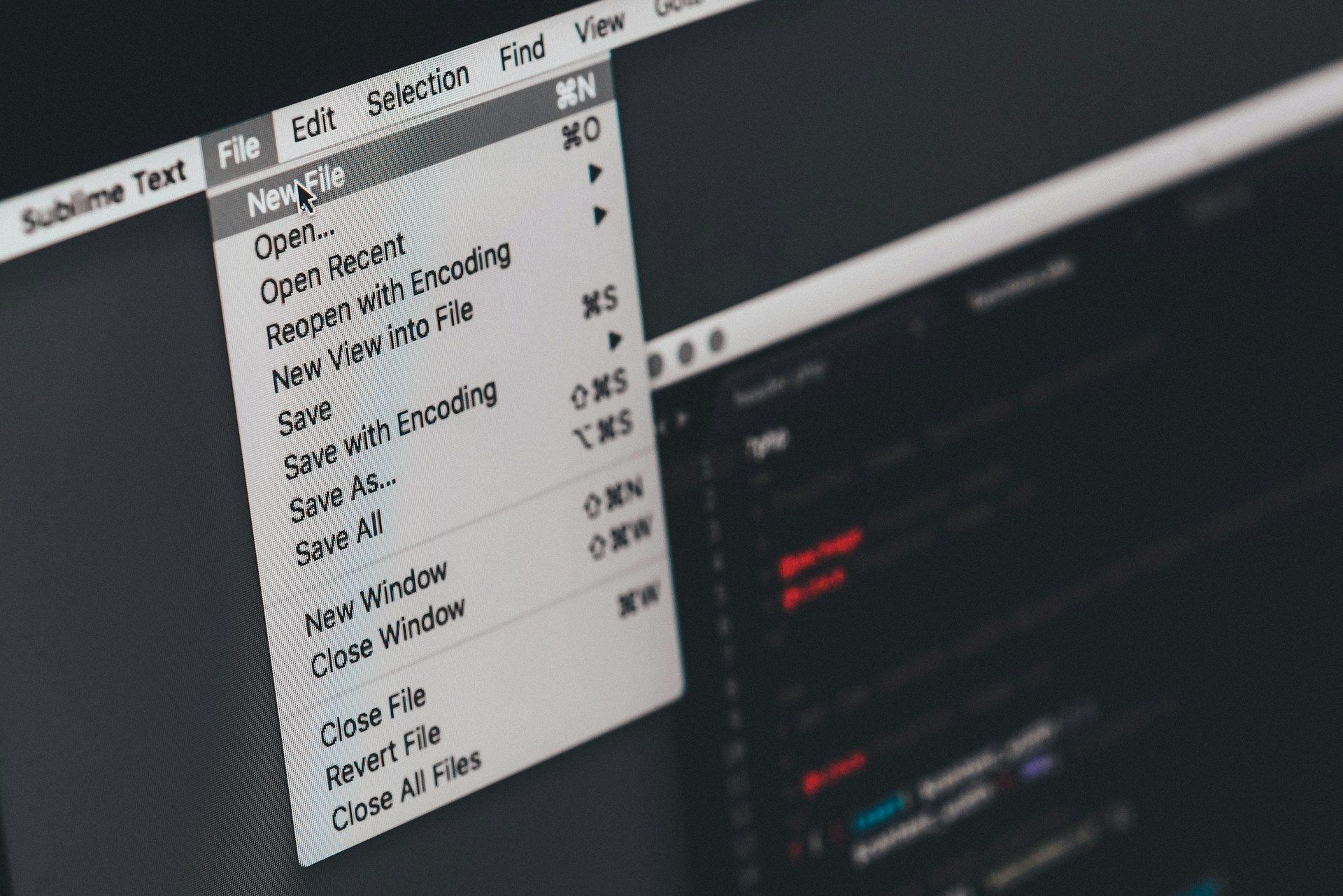 A close-up shot of a computer desktop’s File menu open