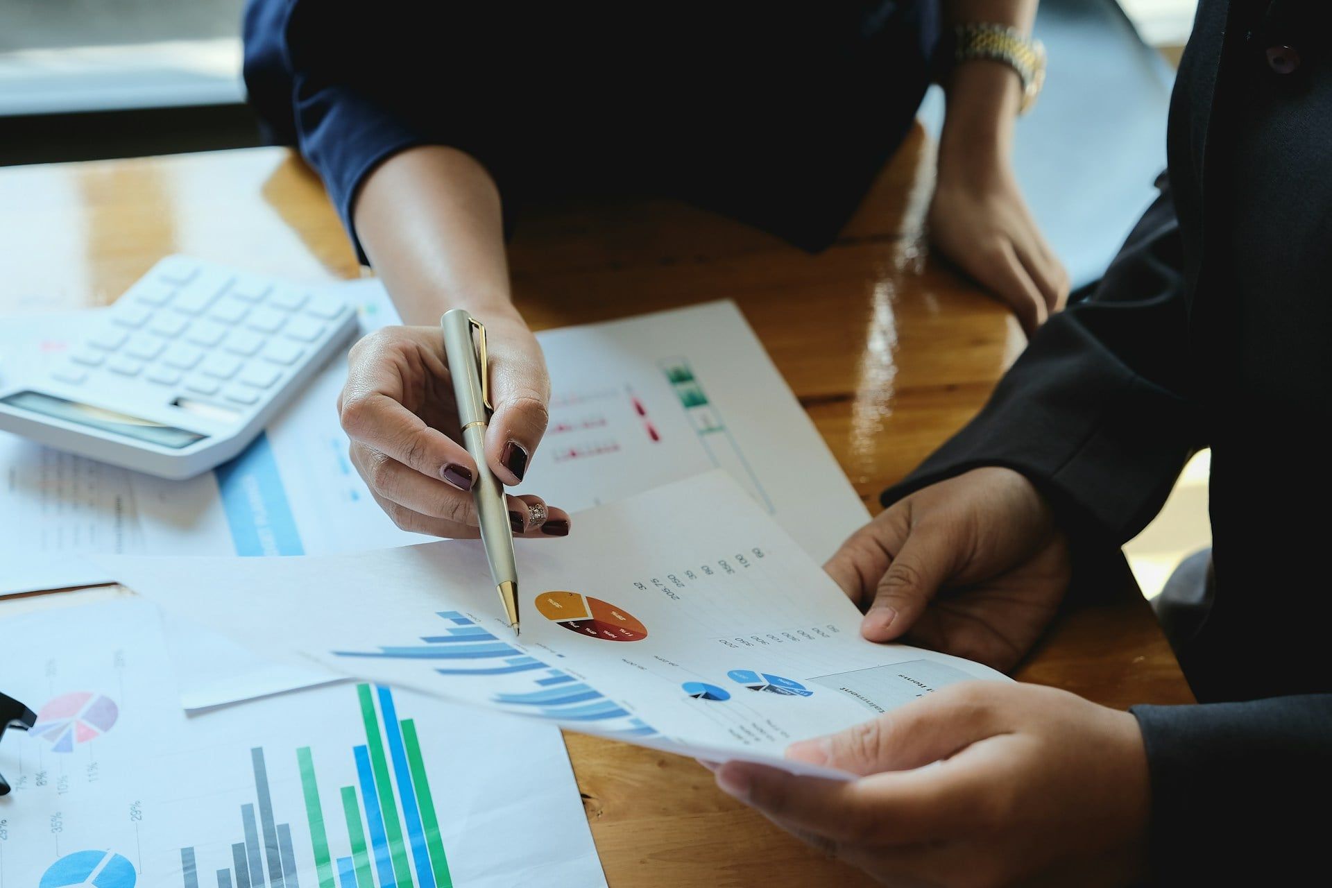 Two Edmonton, AB business owners go through their website and SEO metrics on sheets