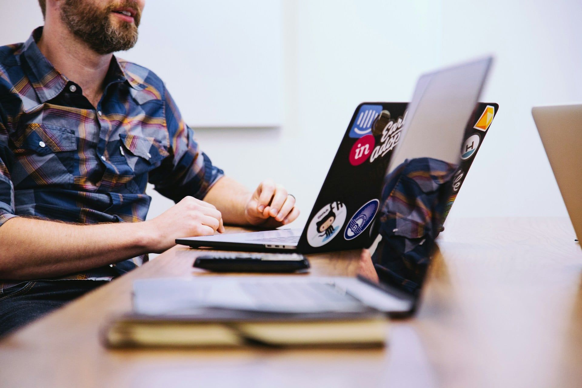A team sit down at the desk on their laptops running some A/B tests