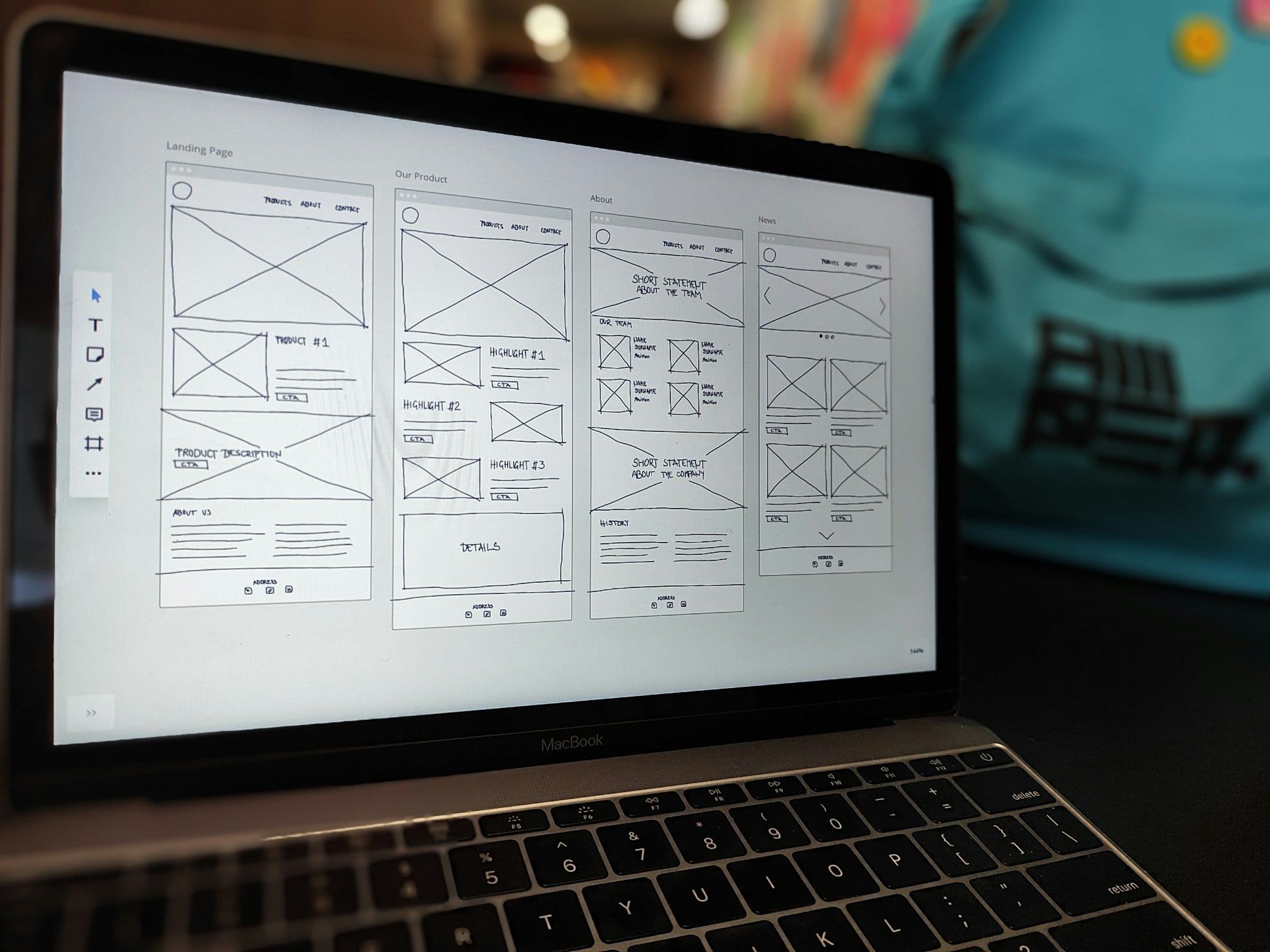 A laptop with a website structure and wireframe on screen