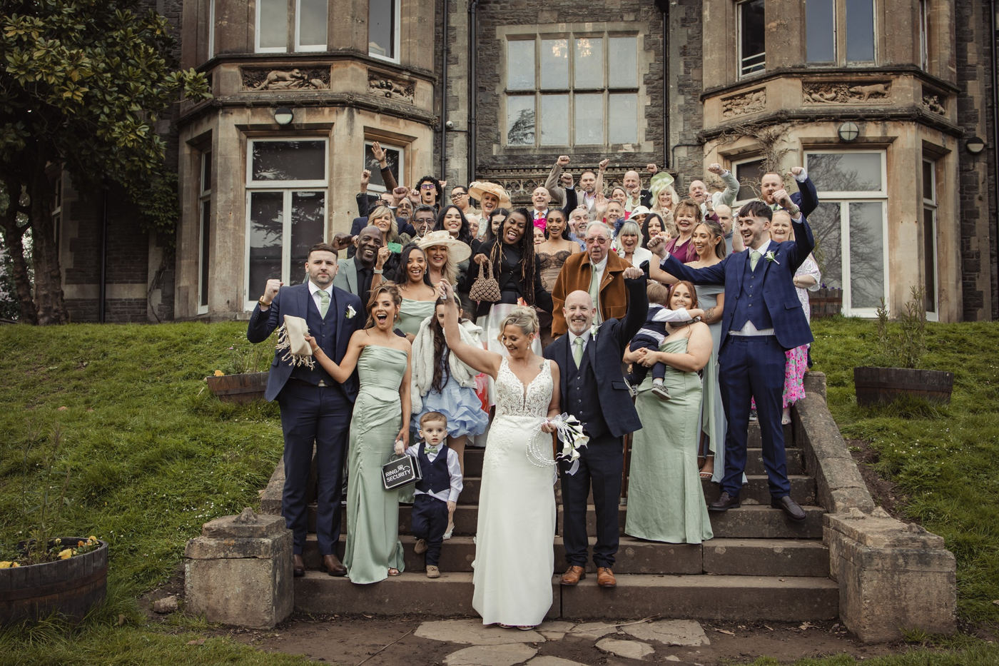 Wedding party celebrating together outside the venue