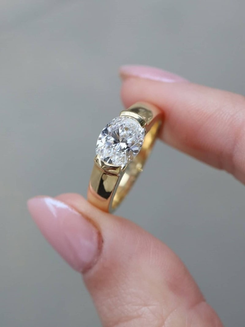 East-west Oval Cut Half Bezel Set Ring