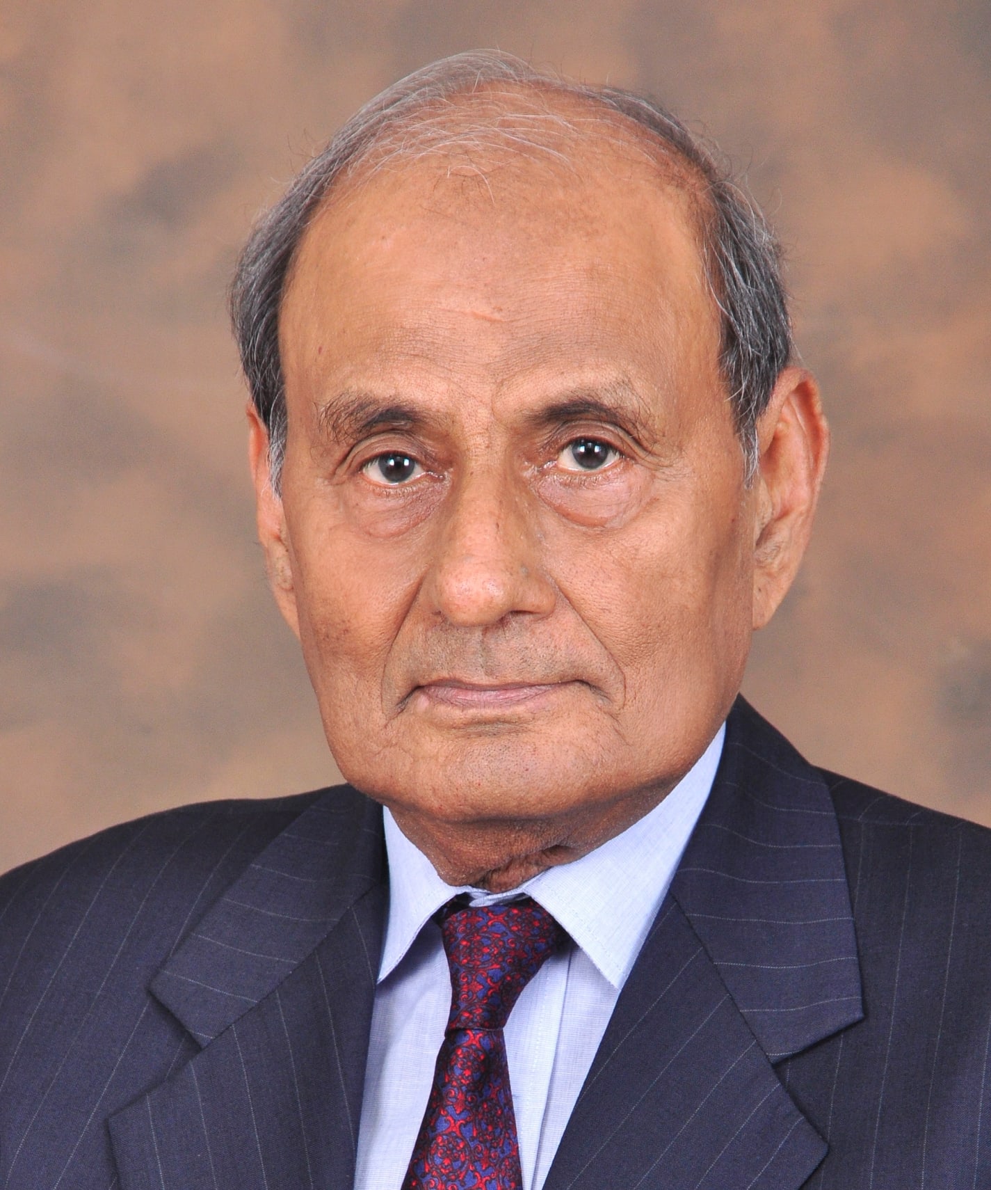 Headshot of Prof. Emeritus Dr. Hasan Aziz