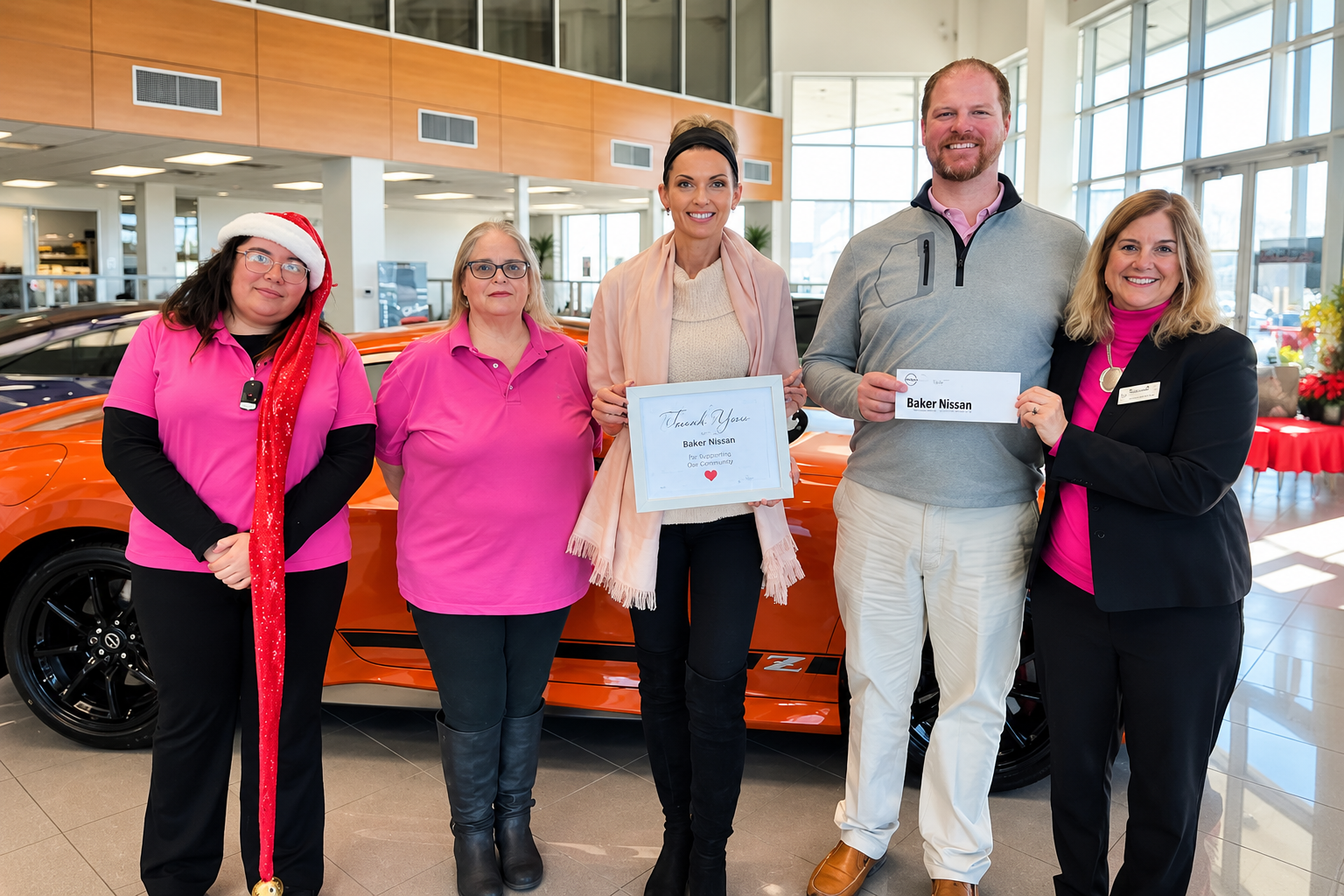 Baker Nissan team supporting breast cancer awareness and Susan G. Komen in Houston in 2024