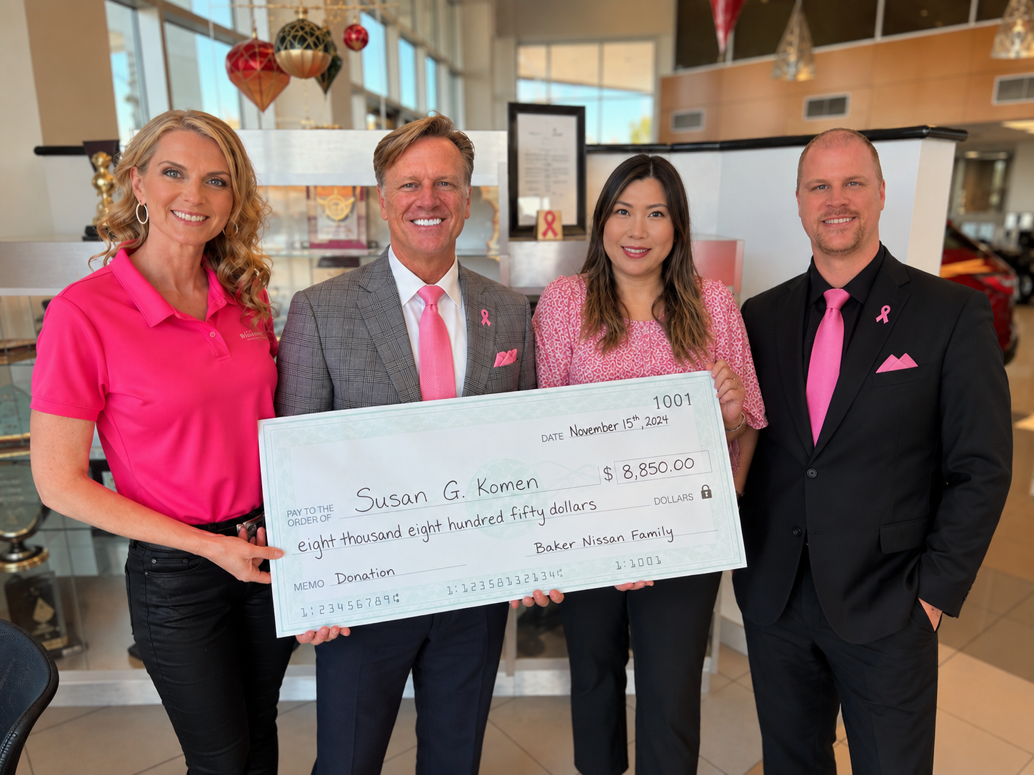 Baker Nissan Susan G. Komen donation presentation during Breast Cancer Awareness Month in Houston in 2021