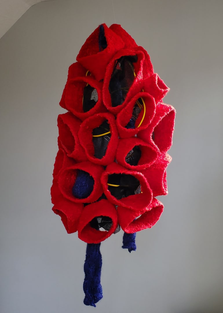 Gina Lee Robbins, Bushwhacking, reclaimed knitted wool and acrylic, wire, found objects, installation variable (suspended or pedestal) 35 X 17 X 17” (image 1)
