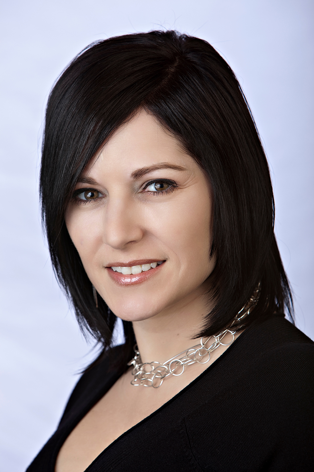 Professional executive headshot portrait with clean background