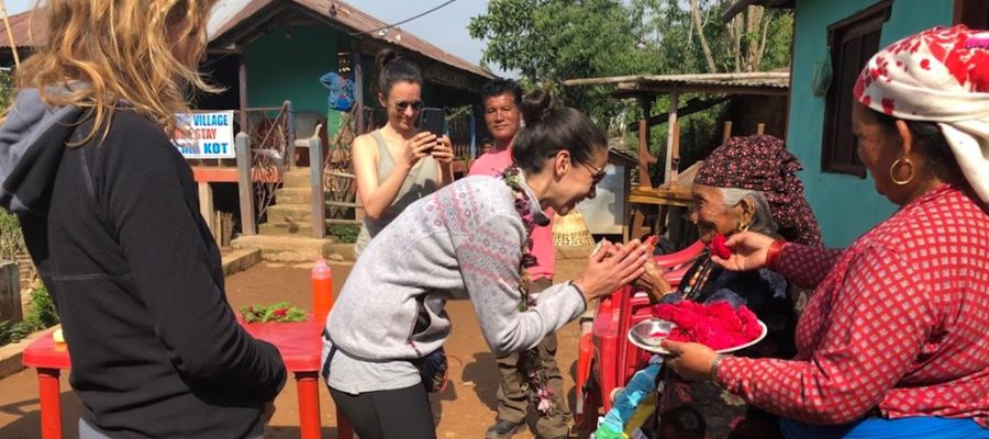 tourist receiving warm welcome from local community