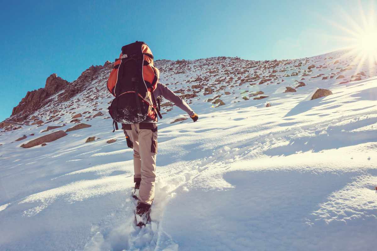 trekker in heavy snow trail during january