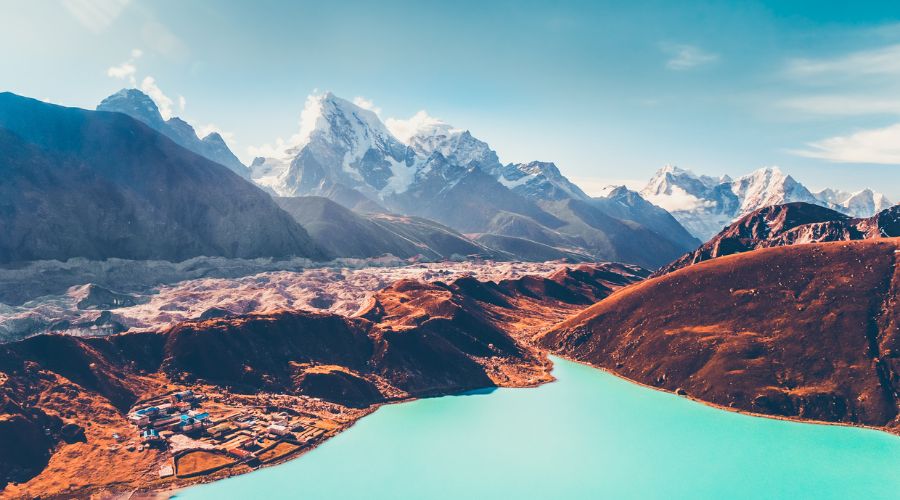 The tranquil waters of Gokyo Lakes, reflecting the grandeur of the surrounding peaks.