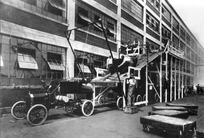 Assembly lines emphasizing productivity marked Henry Ford’s factories. Source: <a href="https://en.wikipedia.org/wiki/Assembly_line#/media/File:A-line1913.jpg">Wikimedia Commons</a>