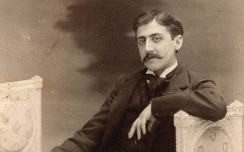 <strong>Marcel Proust</strong> was a French novelist best known for <em>In Search of Lost Time</em>, a novel spanning seven volumes and considered a significant contribution to fiction. Prior to his critical success, he languished over finding the right subject matter and published <em>Please and Days</em>, which was widely panned. (Photo Credit: <a href="https://lithub.com/six-reasons-why-you-must-read-proust/">Literary Hub</a>)