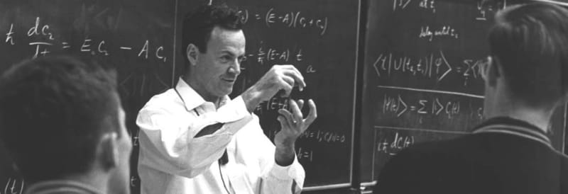 <strong>Richard Feynman</strong> was a theoretical physicist who is also credited with pioneering the field of quantum computing and developing the concept of nanotechnology. He jointly received the Nobel Prize in Physics in 1965. He’s widely known for skill as a teacher. He created <em>The Feynman Lectures on Physics</em>, arguably the most famous physics book ever written, as a professor at the California Institute of Technology. (Photo Credit: <a href="https://www.bbvaopenmind.com/en/science/leading-figures/richard-feynman-the-physicist-who-didnt-understand-his-own-theories">Open Mind BBVA</a>)