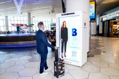 Proto AI hologram answers passenger queries at LaGuardia Airport in New York