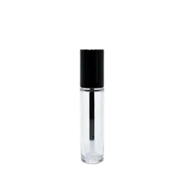 The image shows the JCOP 0.3oz PETG Lip Gloss Tube. The tube is clear, allowing the contents to be visible, and has a cylindrical shape with a rounded base. It includes a silver-colored cap that twists off, revealing an applicator wand inside. The overall design is sleek and modern, with a minimalist aesthetic that highlights the product within. The tube appears to be empty in this particular image.