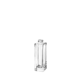 The image features the Calaso 1.0oz Glass Bottle. It is a small, clear glass bottle with a cylindrical shape and a smooth surface. The bottle has a narrow neck and is topped with a screw cap. The design is minimalistic and elegant, making it suitable for a variety of liquids such as perfumes, essential oils, or cosmetic serums. The clarity of the glass allows the contents to be visible.