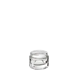 The image shows the Calaso 1.0oz glass jar. The jar is clear and cylindrical with a wide opening, making it suitable for storing creams, lotions, or other similar products. The glass has a smooth surface, and the jar appears to have a thick base, giving it a sturdy look. The jar is empty and does not have any labels or markings on it.