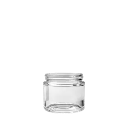 The image shows the Calaso 3.4oz Glass Jar. It is a small, clear glass jar with a round shape and a wide mouth. The jar's body is smooth and transparent, allowing the contents to be easily visible from the outside. The opening is fitted with a threaded neck designed to accommodate a screw-on lid, which is not shown in the image. The simple and sleek design of the Calaso 3.4oz Glass Jar makes it versatile for various storage purposes.