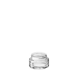 The image shows the Calaso 1.0oz Glass Jar. The jar is made of clear glass and features a cylindrical shape with a wide mouth opening. It has a smooth, transparent surface, allowing the contents inside to be visible. The jar is designed to hold 1.0 ounce of product and is typically used for packaging cosmetics, creams, or small quantities of other products. The overall design is sleek and minimalist.