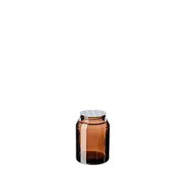 The image features the Calaso 2.9oz Glass Jar HD14098-607. This is a clear, cylindrical glass jar with smooth, straight sides and a wide mouth opening. The jar has a flat base, making it stable when placed on surfaces. The minimalist design allows for easy labeling and visibility of the contents inside. The jar is suitable for various uses including storage of creams, ointments, and other small items.