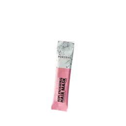 The image shows the Identipak 0.5oz PE StickPack Stickpack, 15ml. This is a small, sleek, cylindrical packaging designed for single-use applications. The stickpack is predominantly white with minimalistic design elements. It appears to be made of a flexible material, suitable for containing liquids or gels. The product is compact and portable, ideal for travel-sized samples or single-serving portions.